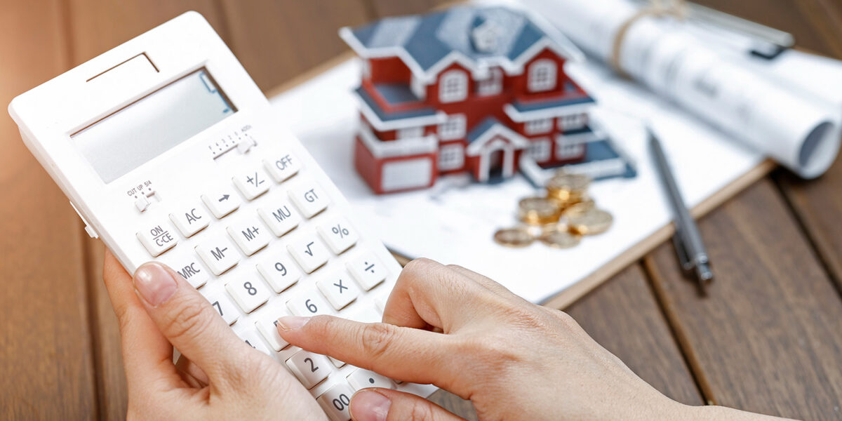 Homeowner calculating the costs and savings for a remortgage